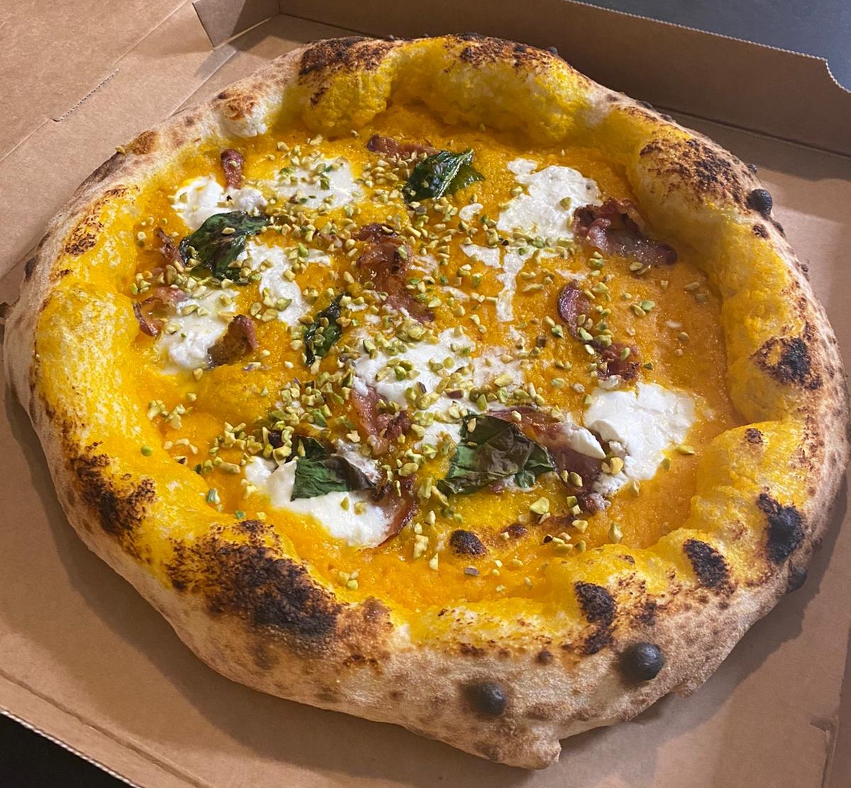 Crema di zucca, Guanciale, burrata, Granella di pistacchio di bronte.